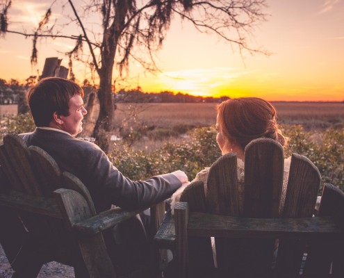 Bride and Groom Relaxing by the Marsh