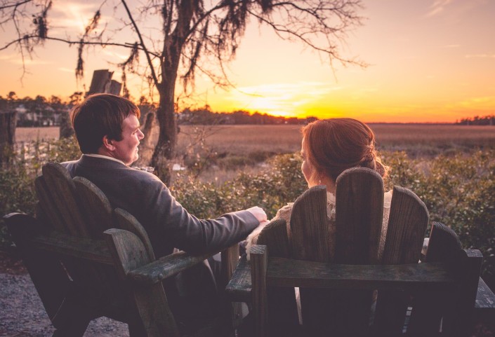 Bride and Groom Relaxing by the Marsh