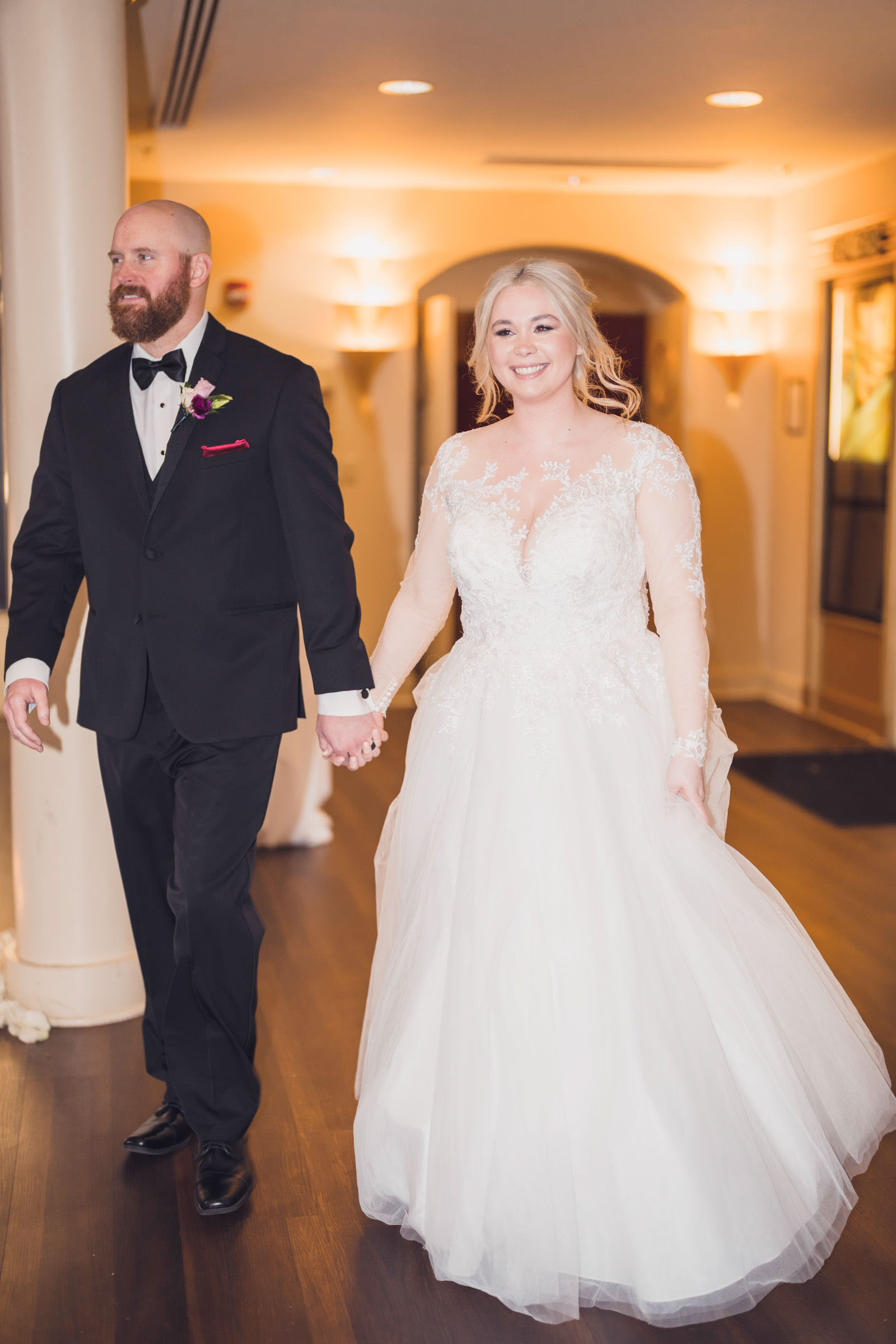 American Theater Wedding Couple Newlyweds walking hand in hand through the lobby of the American Theater after their ceremony