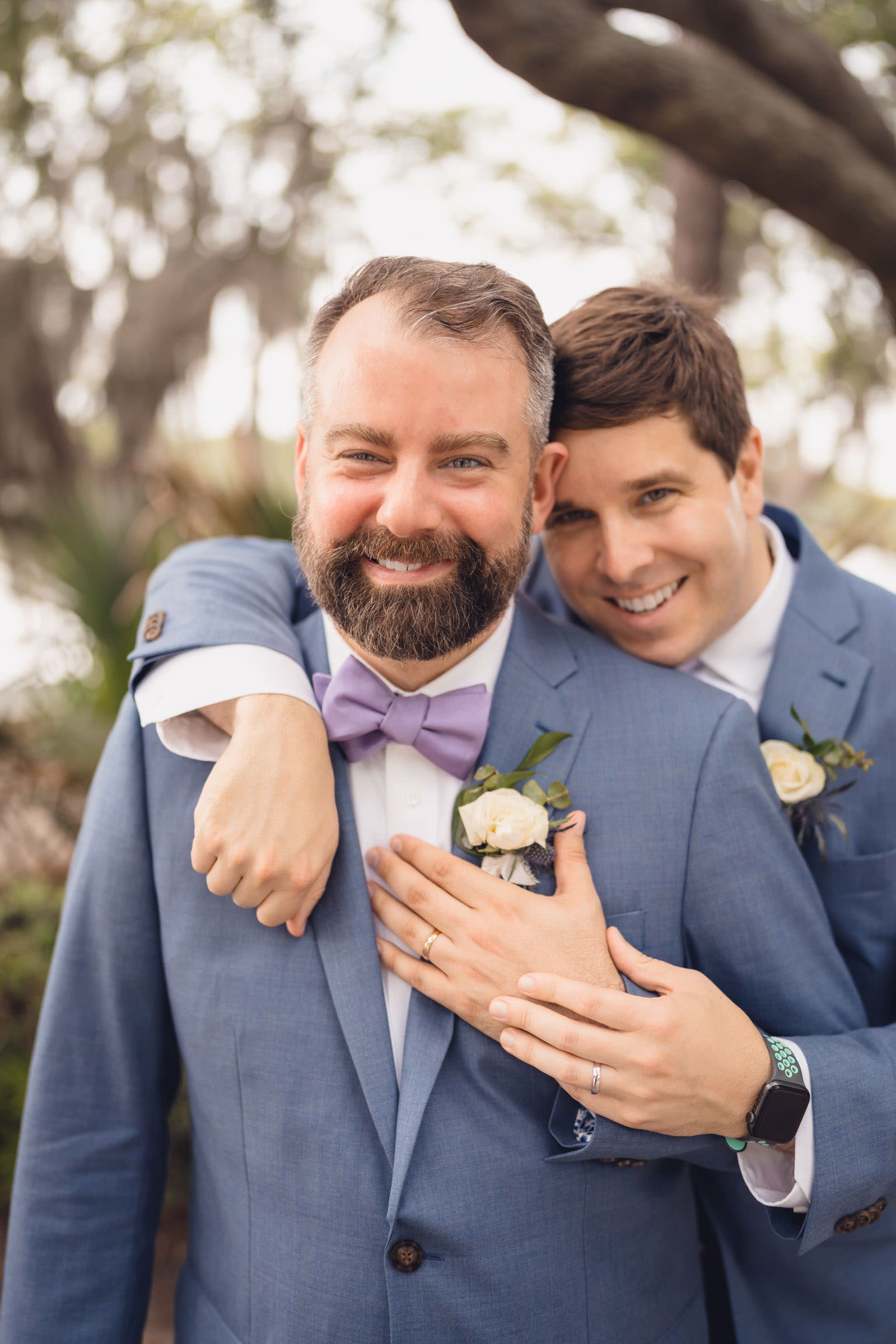 very married Close portrait of two grooms smiling together after their wedding ceremony at Creek Club at I’On in Mount Pleasant.