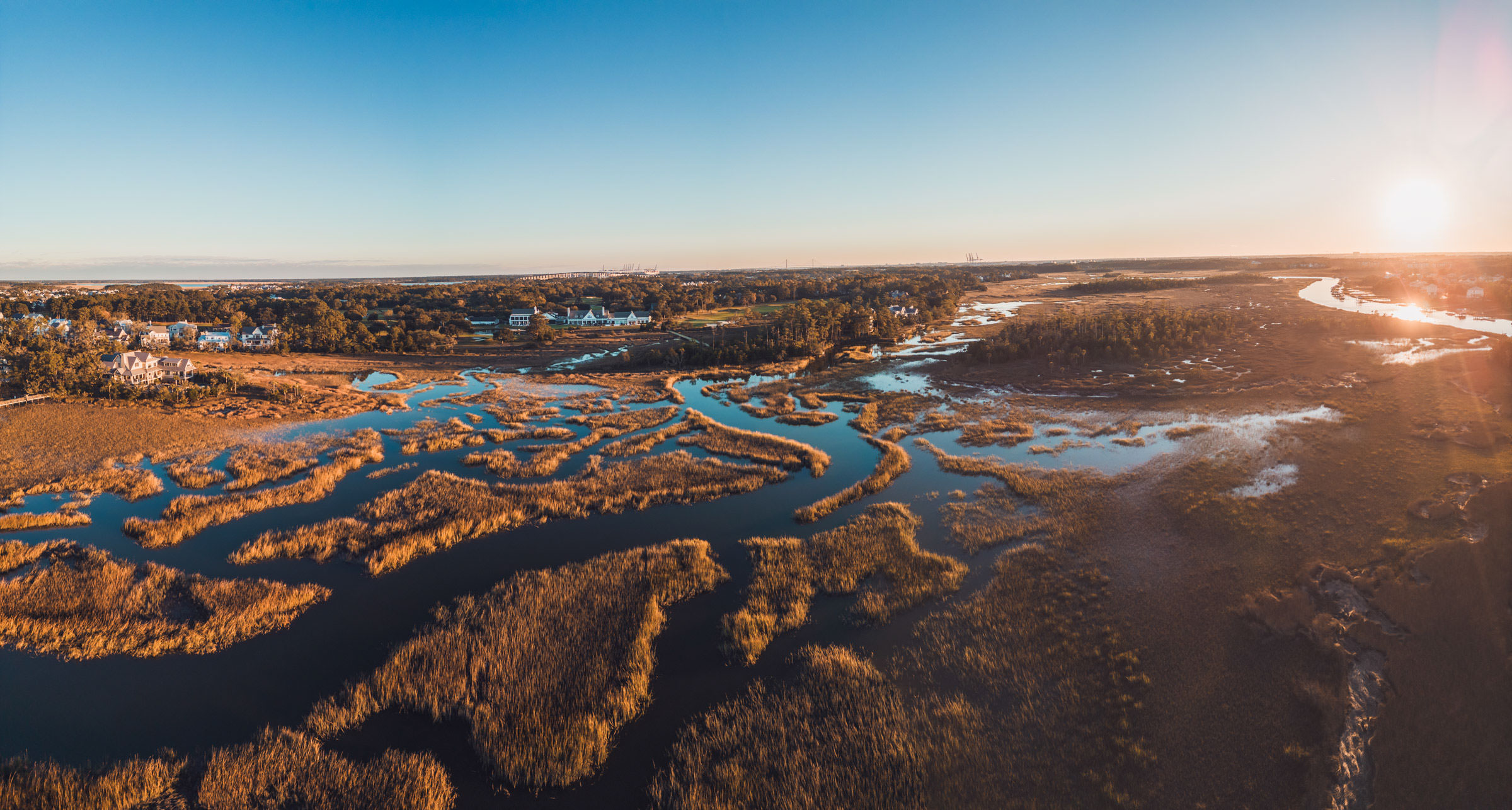 Daniel Island Club From Above Aerial sunset photograph of winding Lowcountry marsh creeks surrounding the Daniel Island Club and nearby homes.