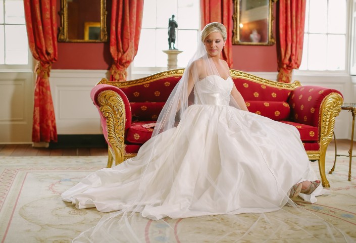 Bride Sitting in Red Room