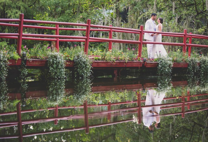 Wedding couple on the Red Bridge at Magnolia Plantation