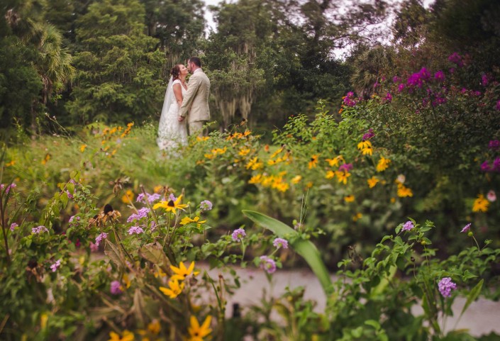 Flower field with bride and groom