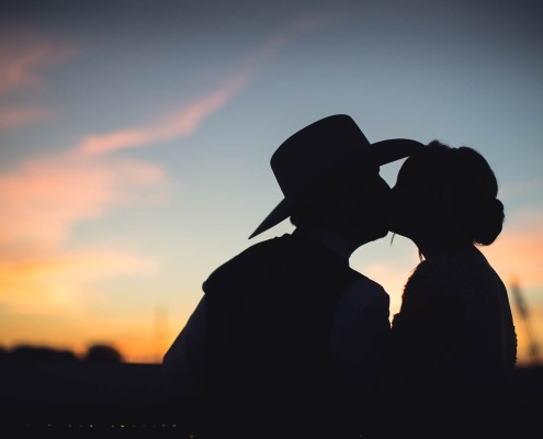 cowboyhat sunset portrait bride and groom