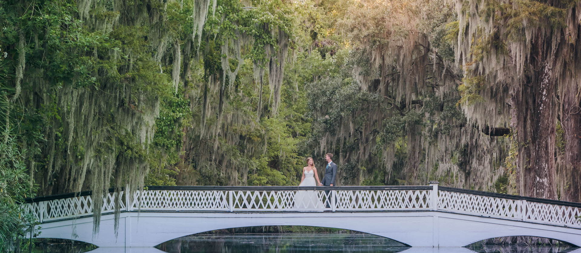 bride and groom on white bridge