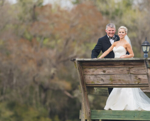 Bride and Groom on a dock at Lovegrove Estate