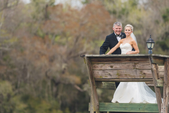 Bride and Groom on a dock at Lovegrove Estate