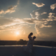 Silhouette of Bride and Groom on Hotel Rooftop at Sunset