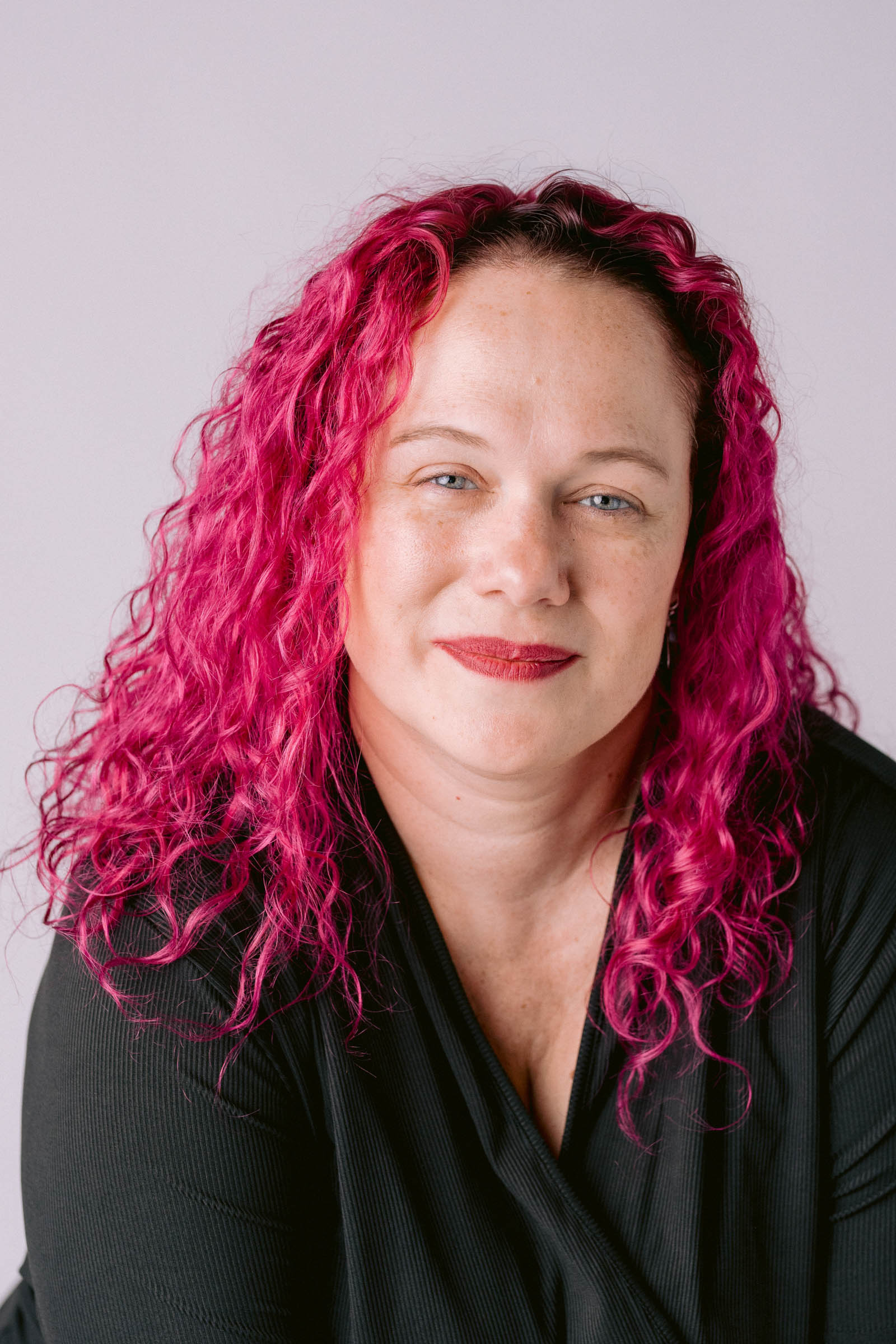 Head and shoulders portrait of Charleston Wedding Photographer Mell Bell