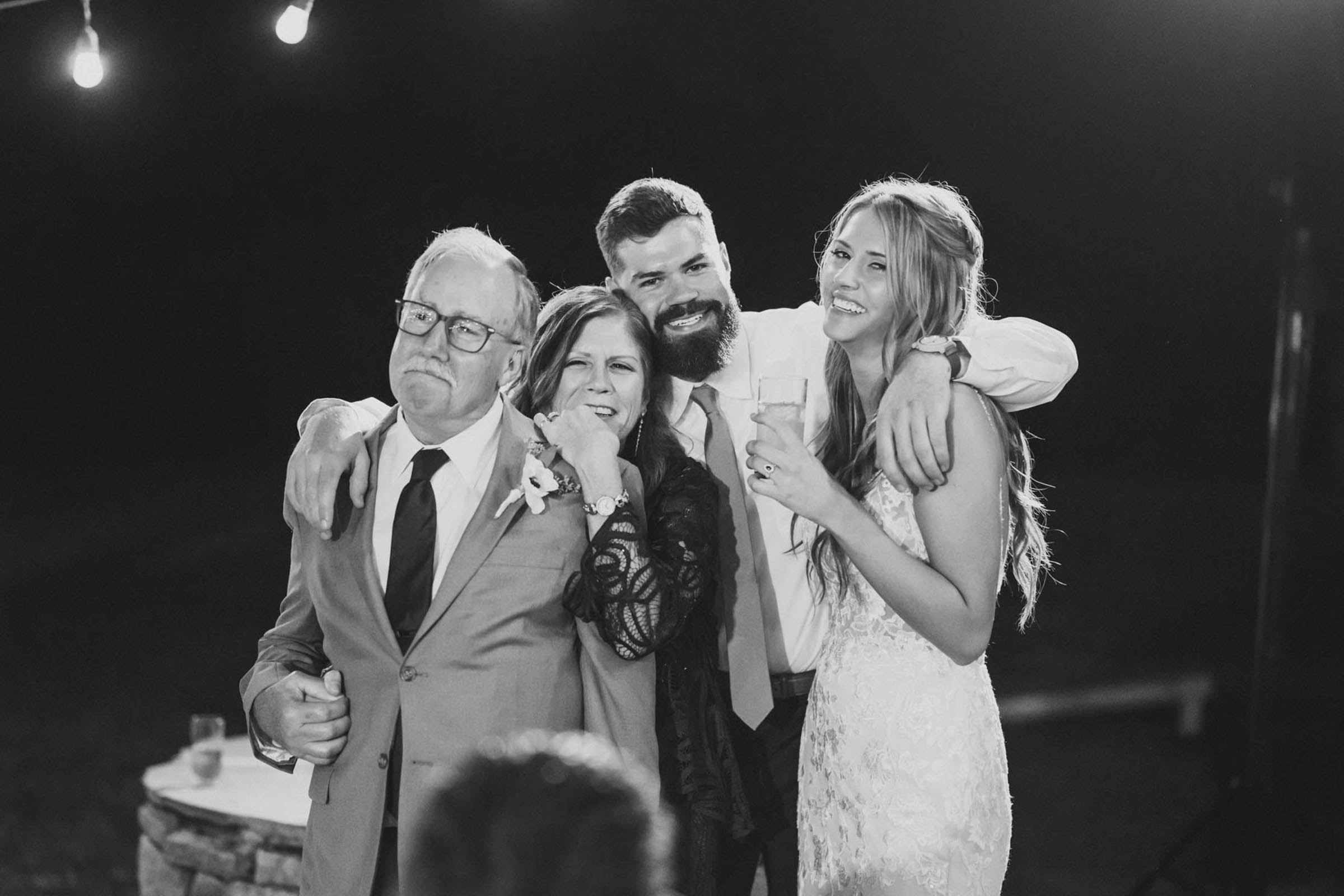The bride's family watches one of the special dances during a reception portrait at Magnolia Plantation and Gardens in Charleston, South Carolina.
